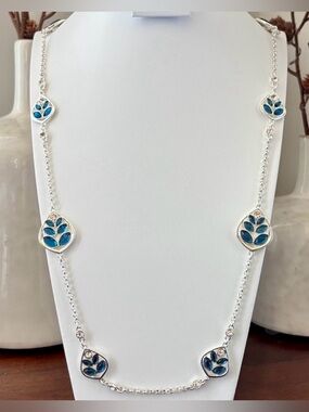Gloria Vanderbilt Reversible Silvertone chain,teardrop w/blue & clear stones